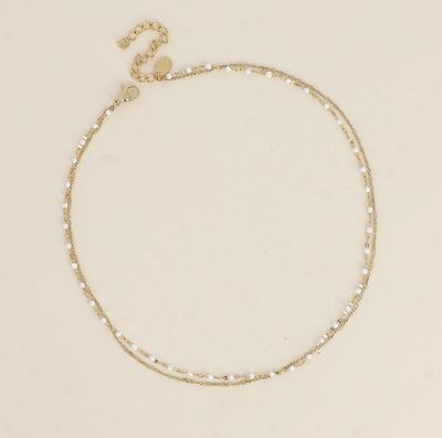 Bracelet/ras de cou en acier doré et détails blancs