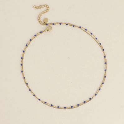 Bracelet/ras de cou en acier doré et détails émeraude