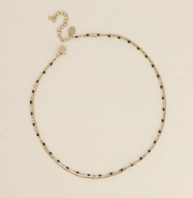 Bracelet/ras de cou en acier doré et détails noir