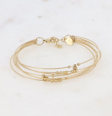 Jonc en acier doré à 7 anneaux striés et lisses avec perles en acier