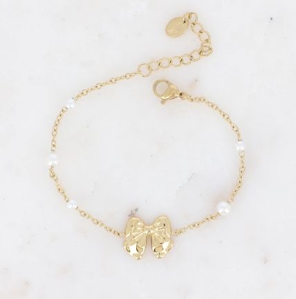 Bracelet en acier doré avec nœud papillon et perles synthétiques
