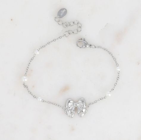 Bracelet en acier avec nœud papillon et perles synthétiques