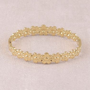 Jonc à motifs fleuris en acier doré