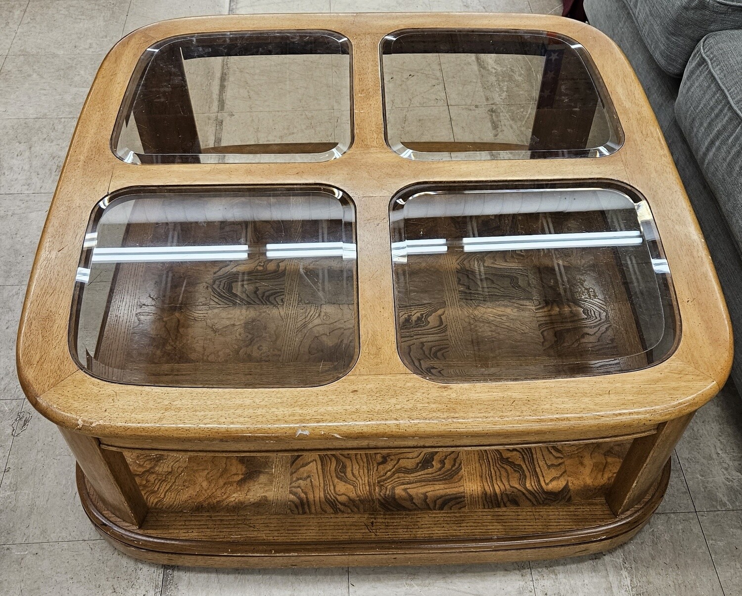 "Versatile Charm: Wood & Glass Coffee Table on Wheels"