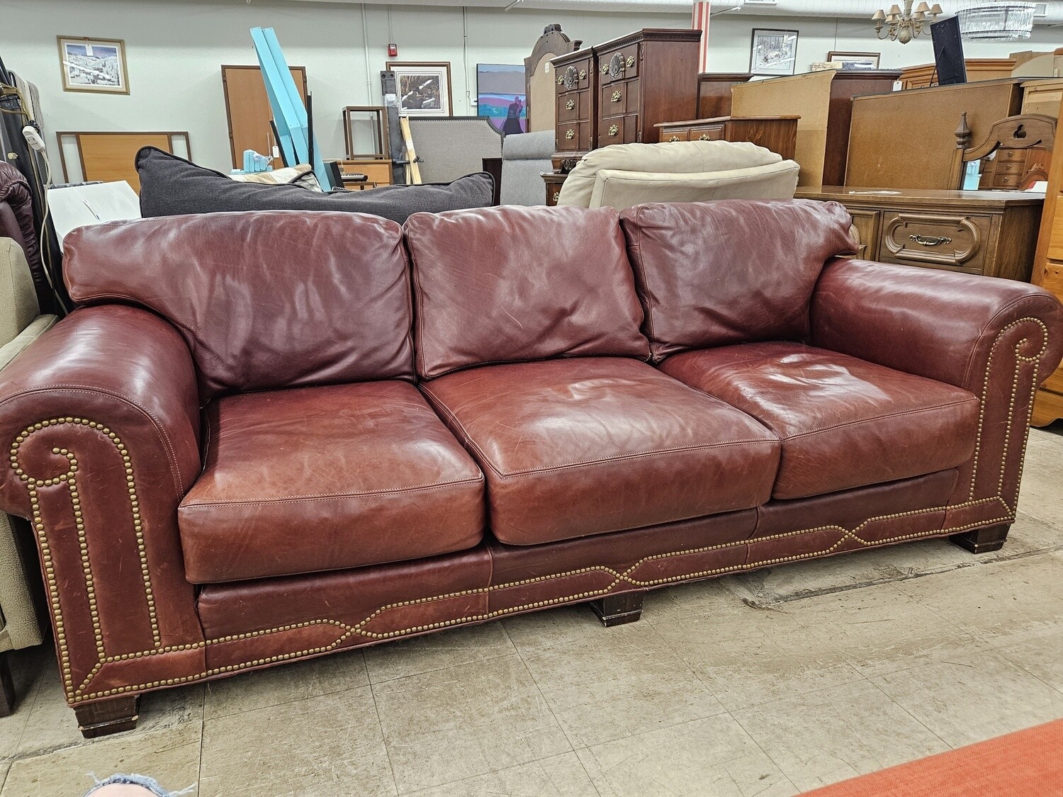 Red Nail Trimmed Leather Couch