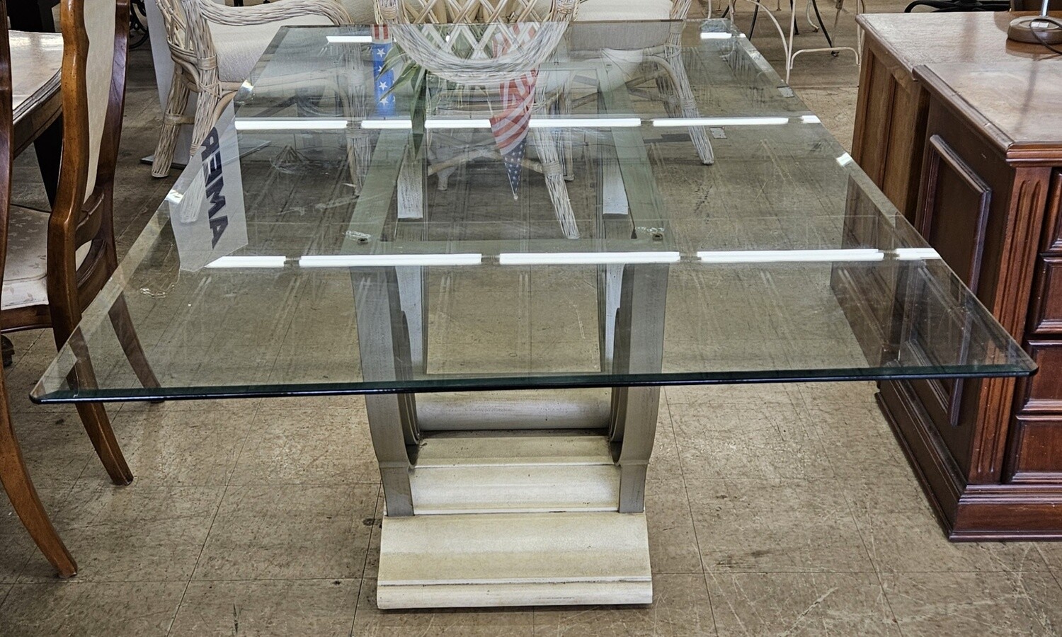 Glass dining table with butterfly base
