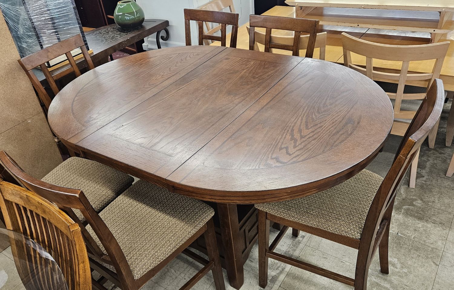 Counter height dining table with six chairs.