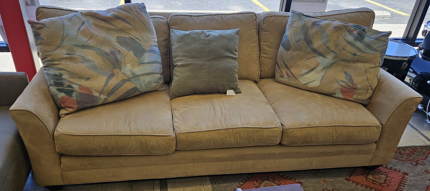 Tan three-seater couch from Miles Talbott,