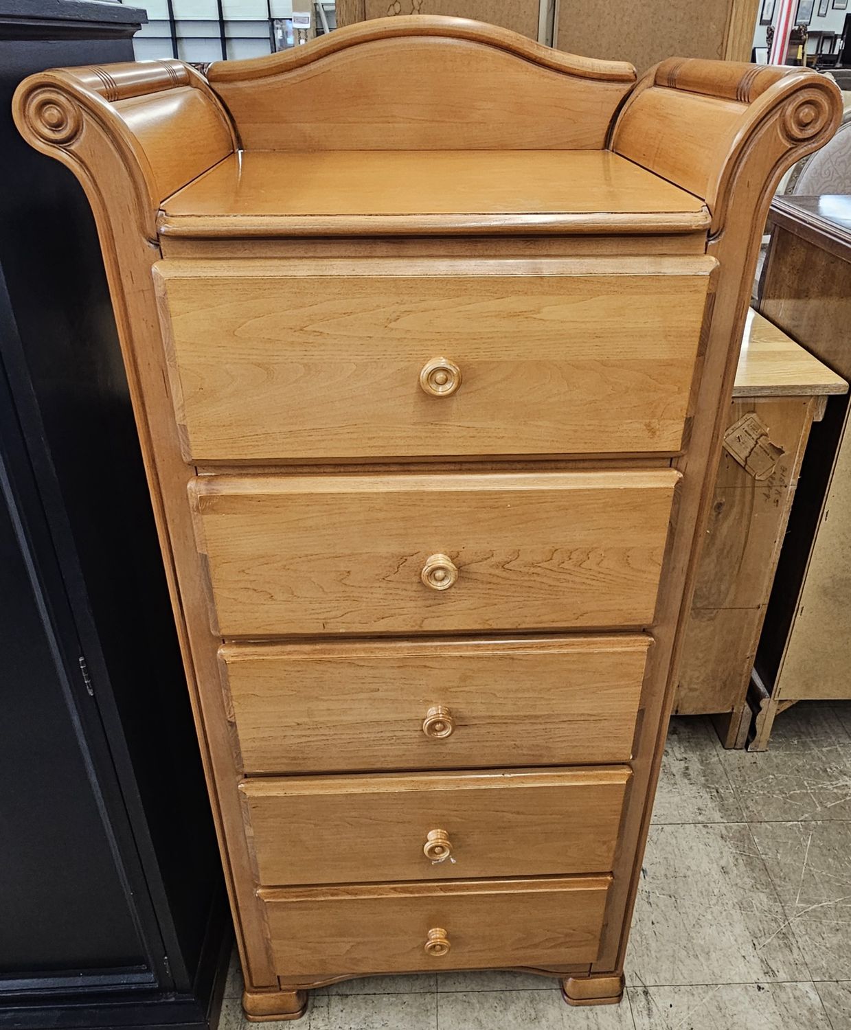 A tall, slender dresser