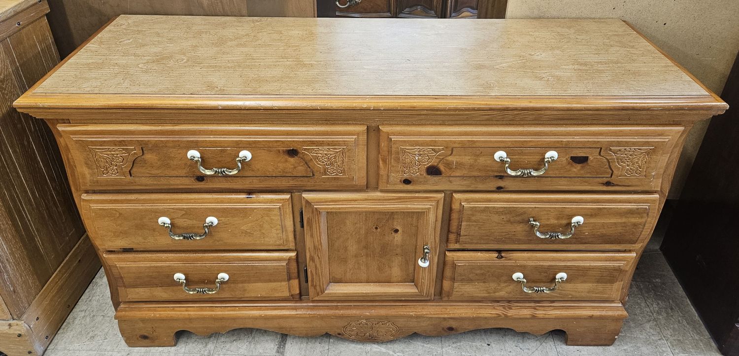 Floral carved wooden lowboy dresser.