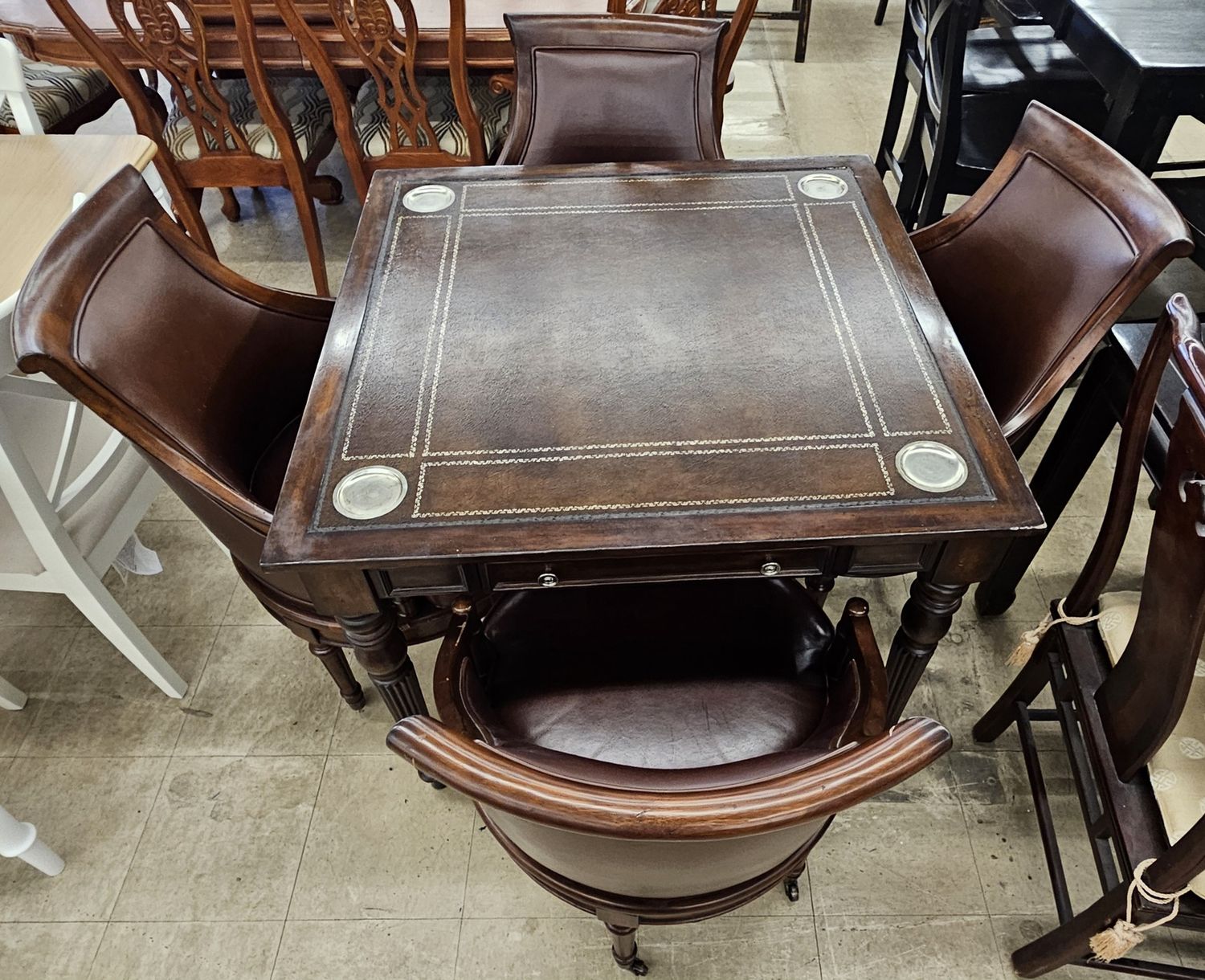 Exquisite Leather Top Game Table with 4 leather chairs.