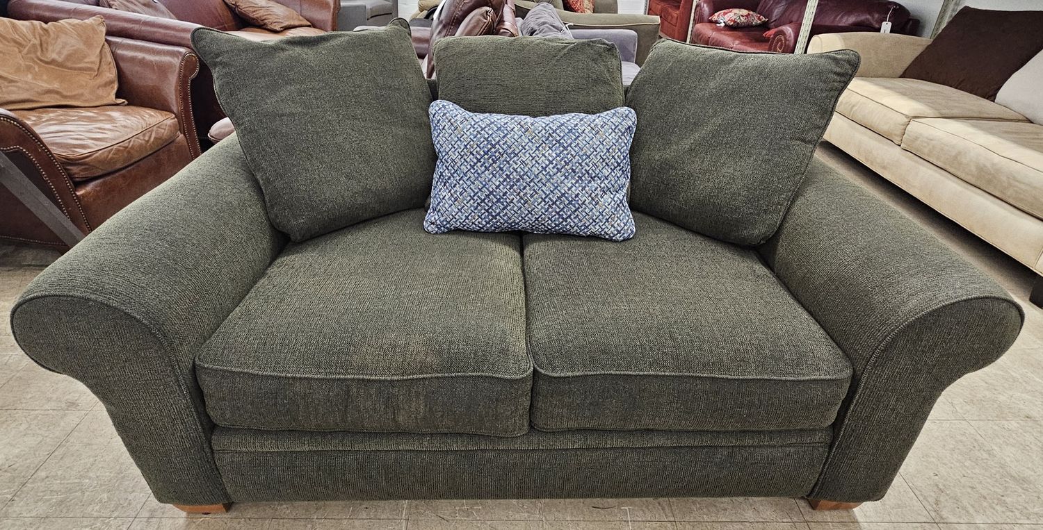 Dark green fabric loveseat