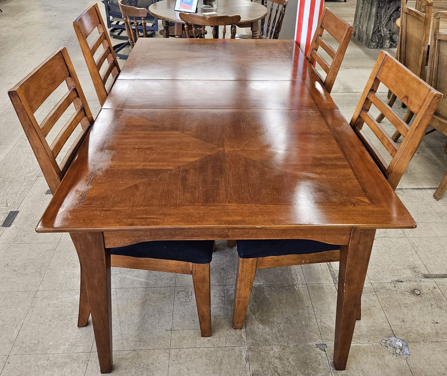Elegant cherry wooden dining table with 4 chairs.