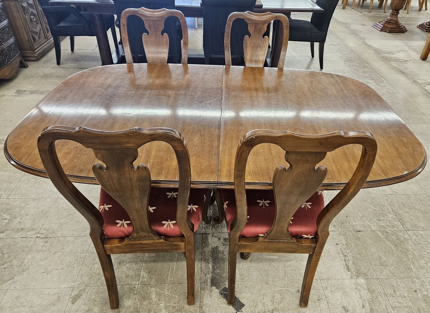 Formal Queen Anne style dining table and four chairs.