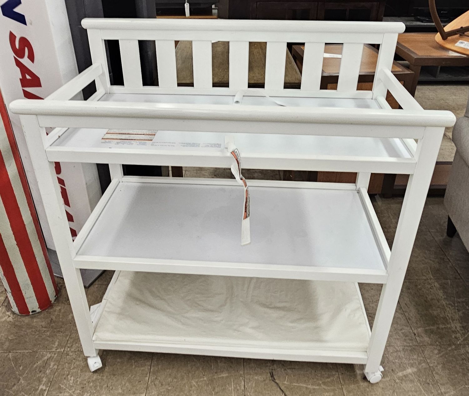 White baby changing station on wheels