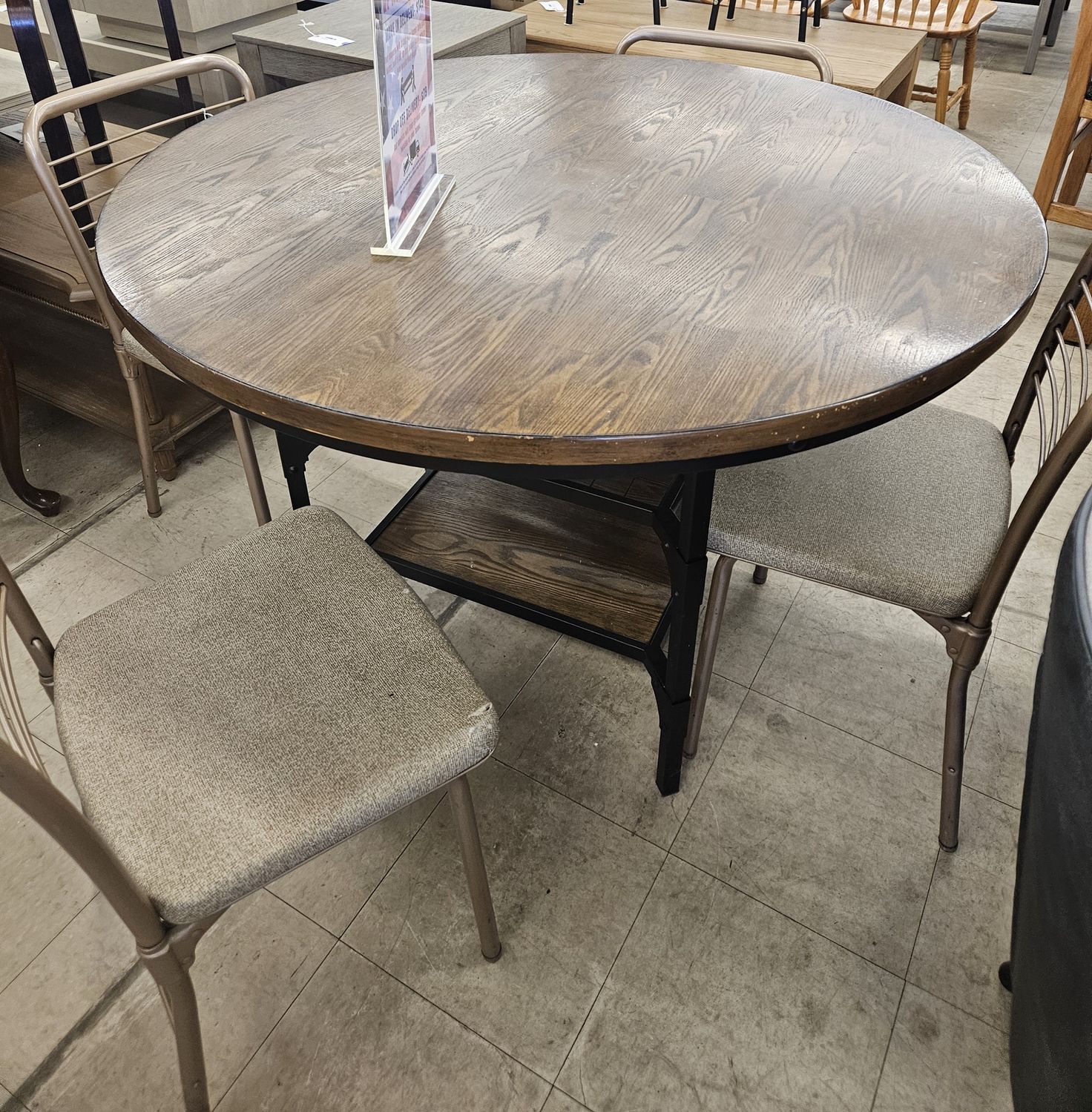 Round walnut-colored oak dining table &amp; 4 chairs