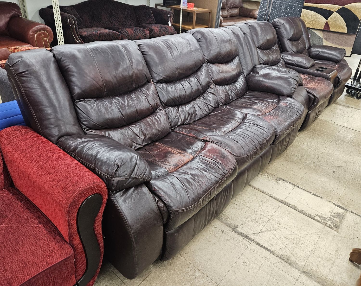 Dark brown leather reclining couch and loveseat