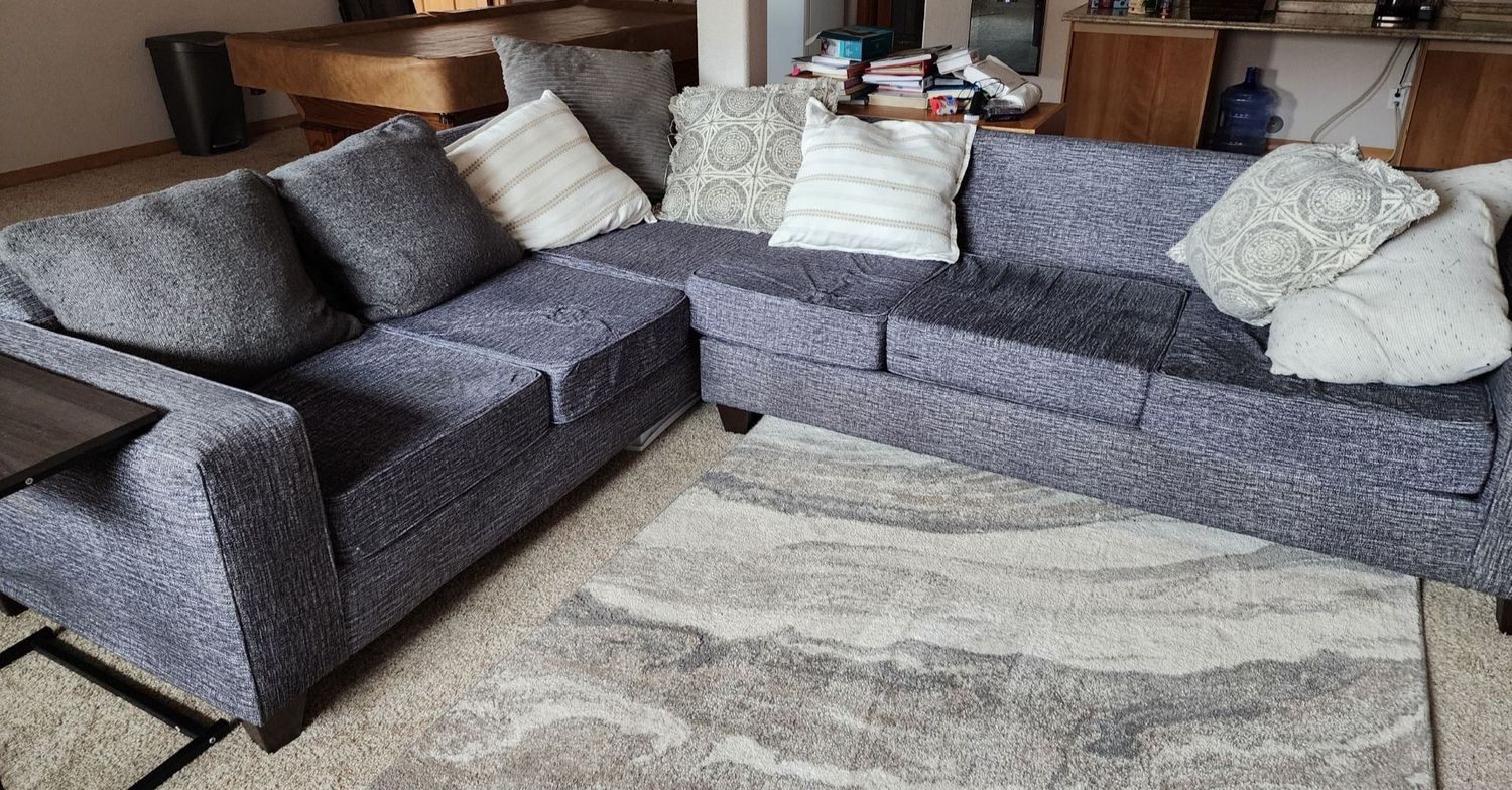 Modern and versatile L-shaped grey couch