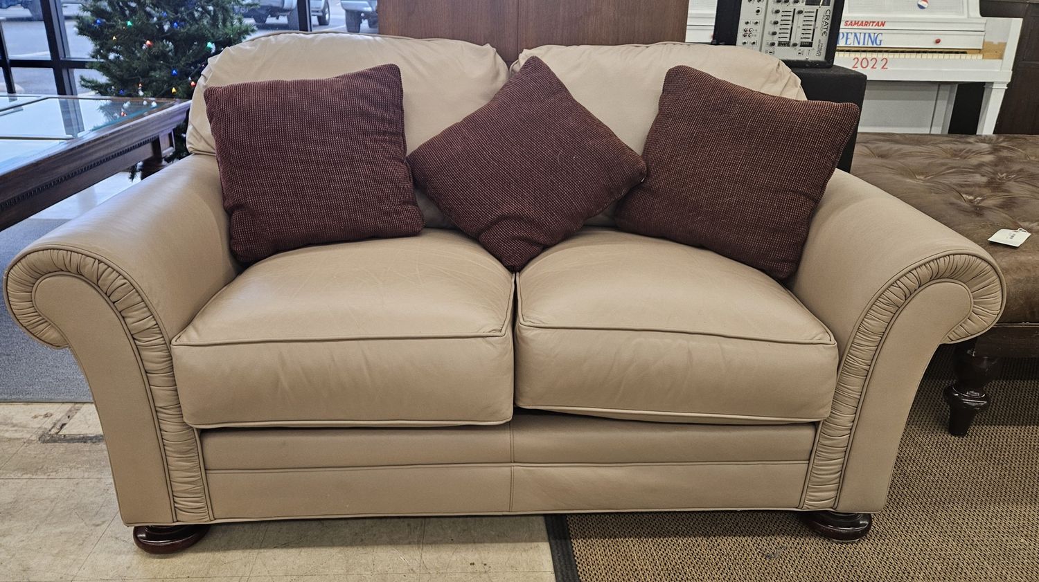 Light beige two-seater leather loveseat