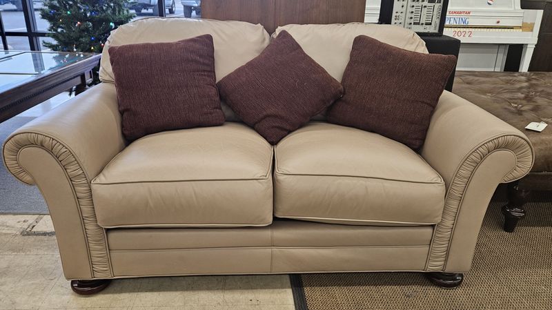 Light beige two-seater leather loveseat