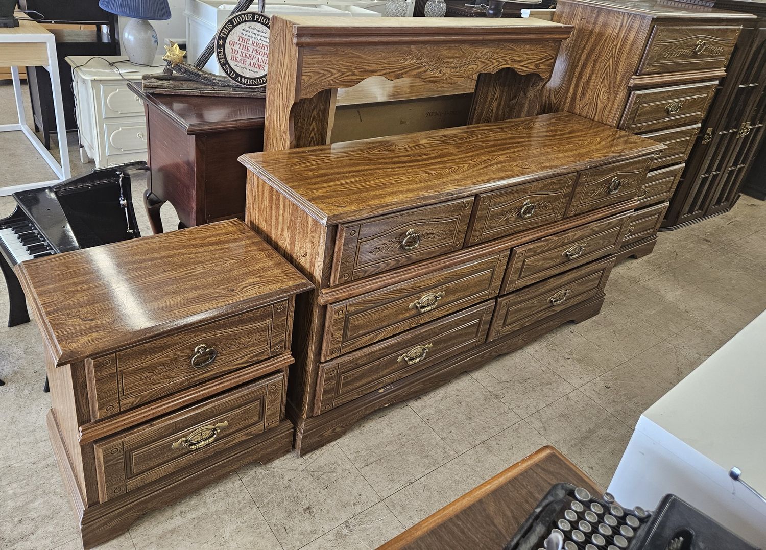 3-piece bedroom set including a dresser with mirror, a tall chest, and a nightstand
