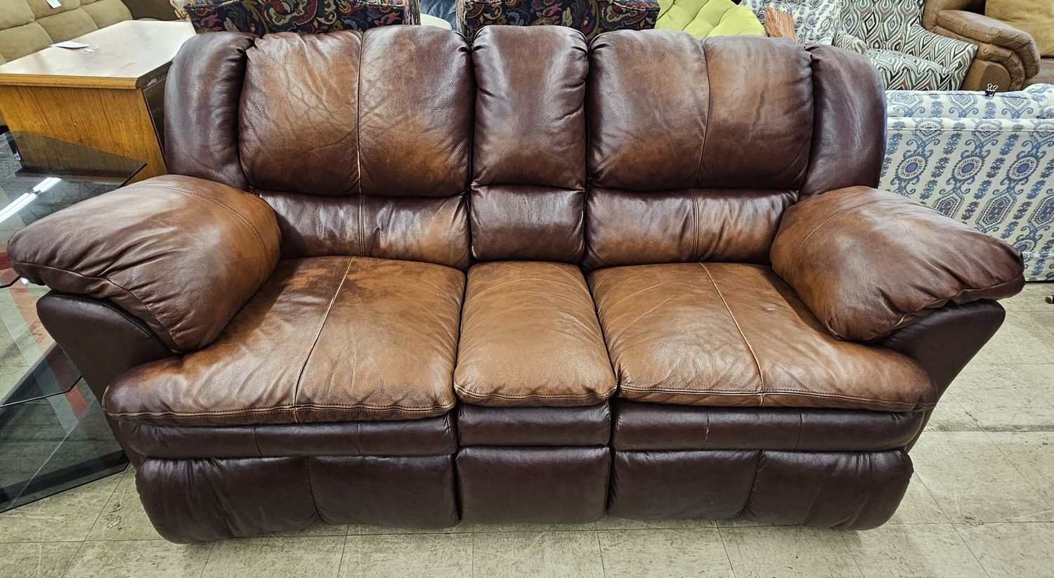 Brown leather reclining sofa