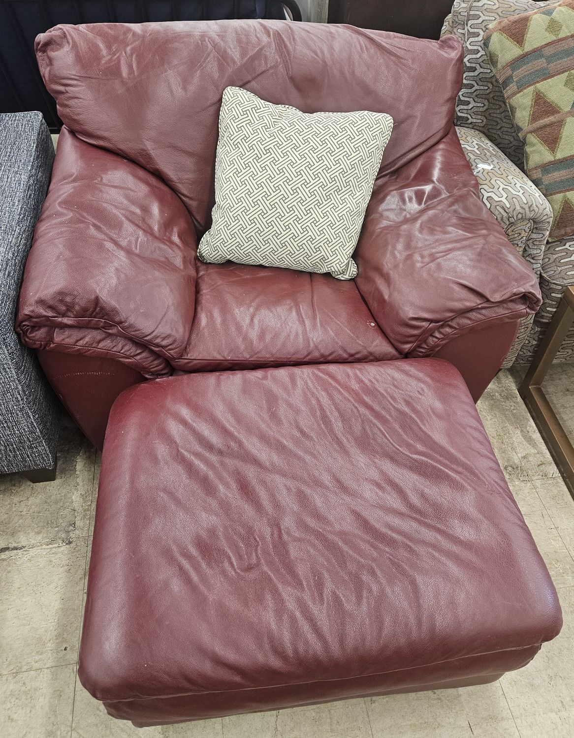 Burgundy leather armchair and ottoman