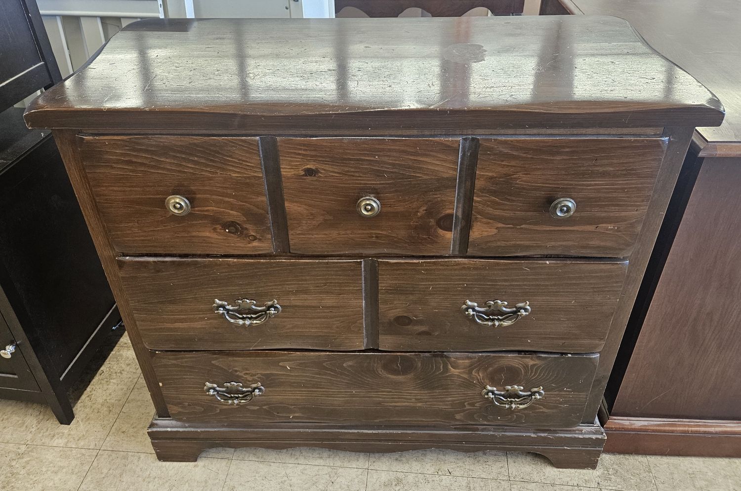 Dark brown wood chest of drawers