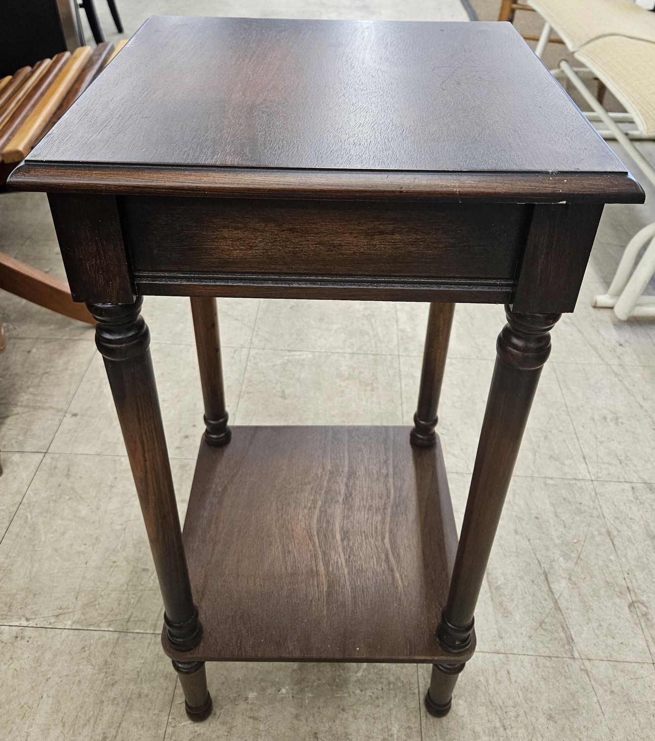 Dark brown wooden side table