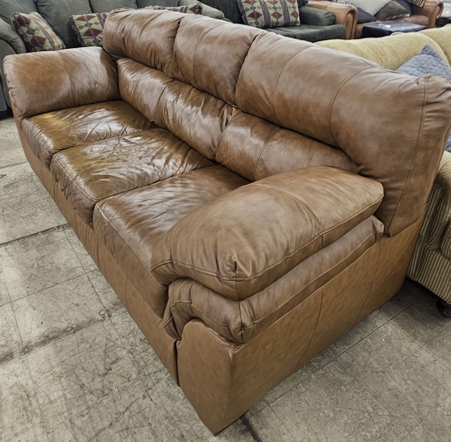 3-seat leather sofa in a warm brown hue