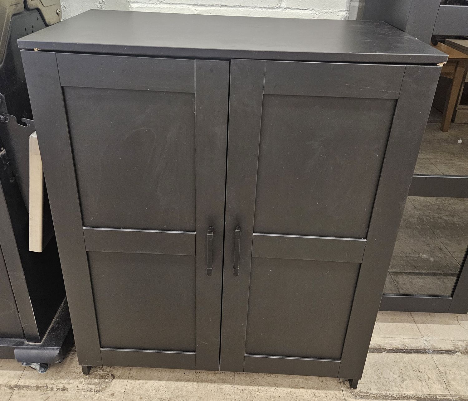 Black IKEA BRIMNES cabinet with two doors