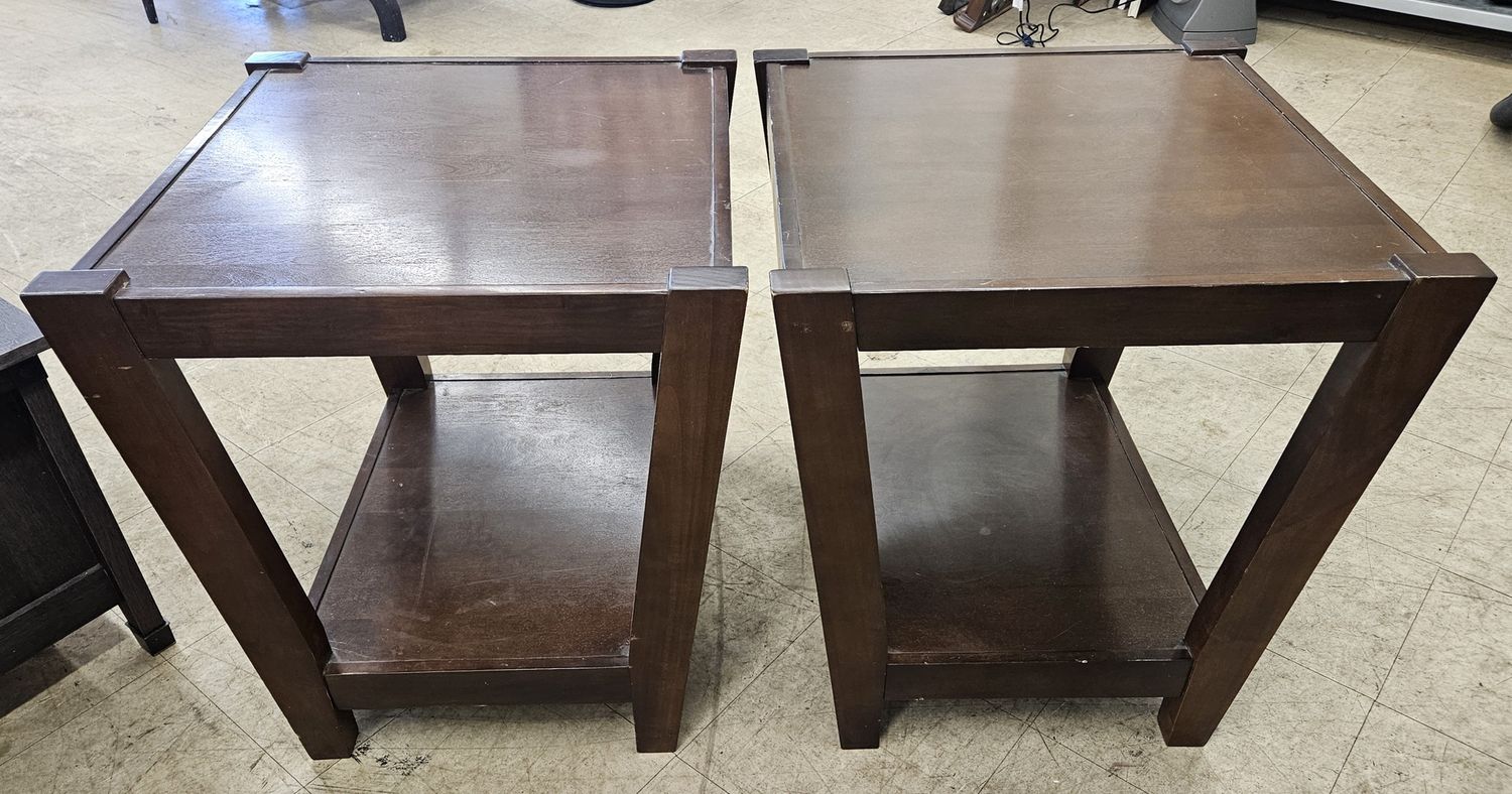 Two matching dark wood end tables