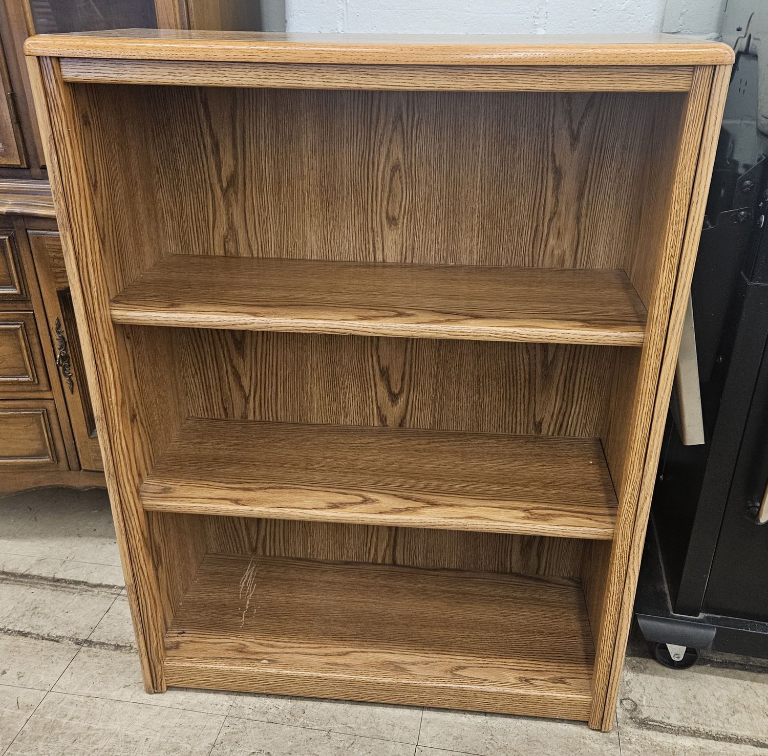 Wooden bookcase with natural oak finish