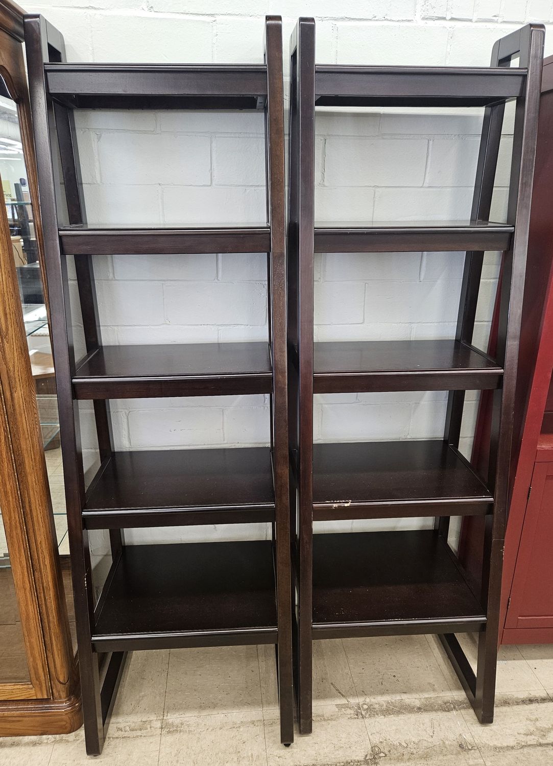 Two dark brown wooden ladder-style