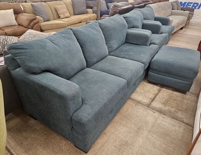 Teal-colored couch set