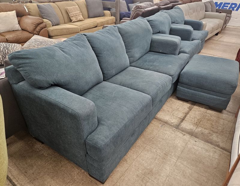Teal-colored couch set