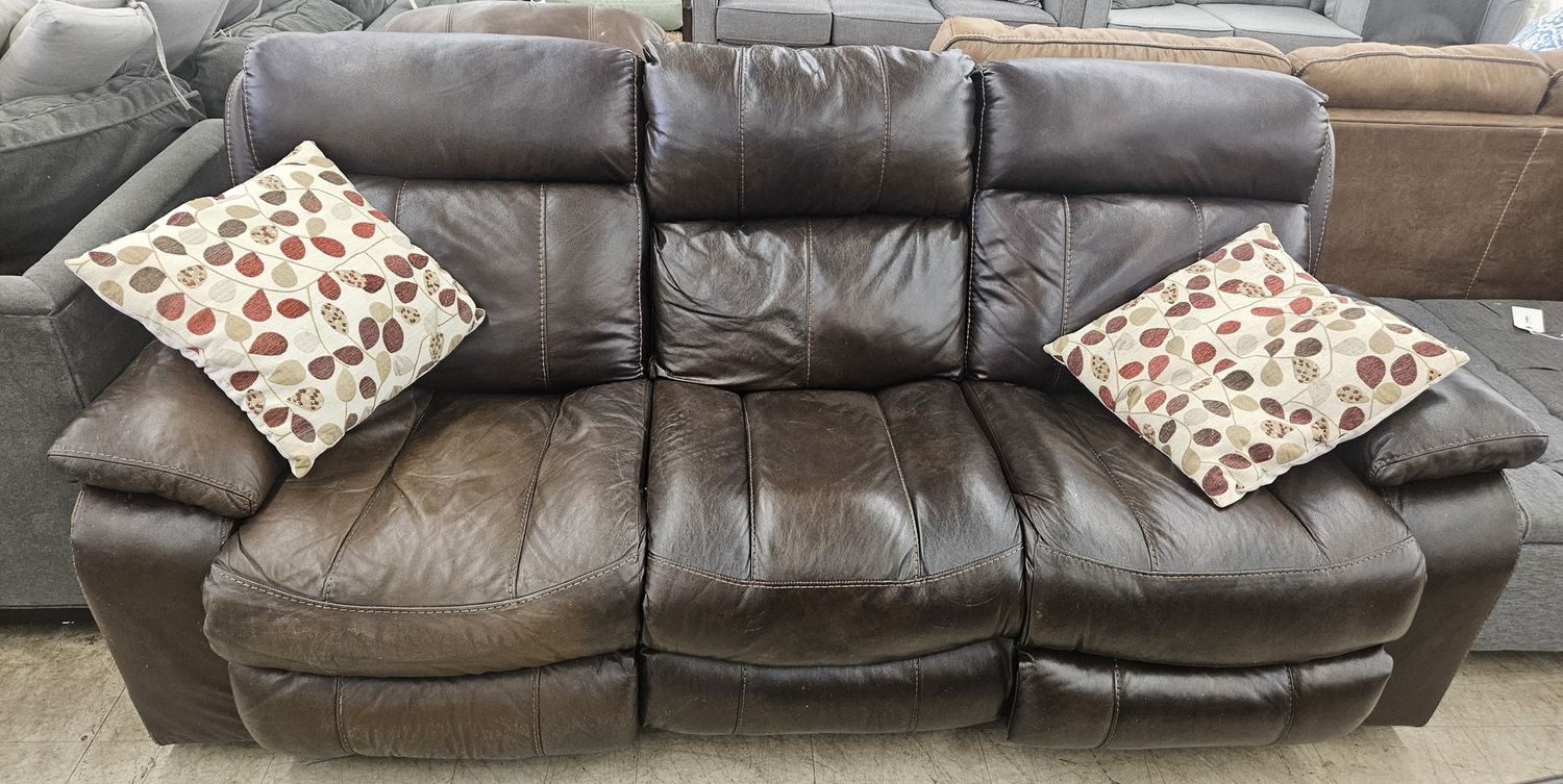 Comfortable, dark brown leather reclining sofa