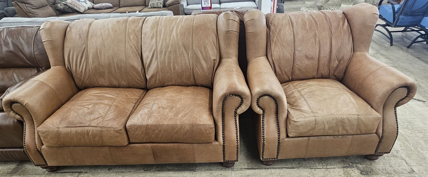 Brown leather loveseat &amp; armchair.