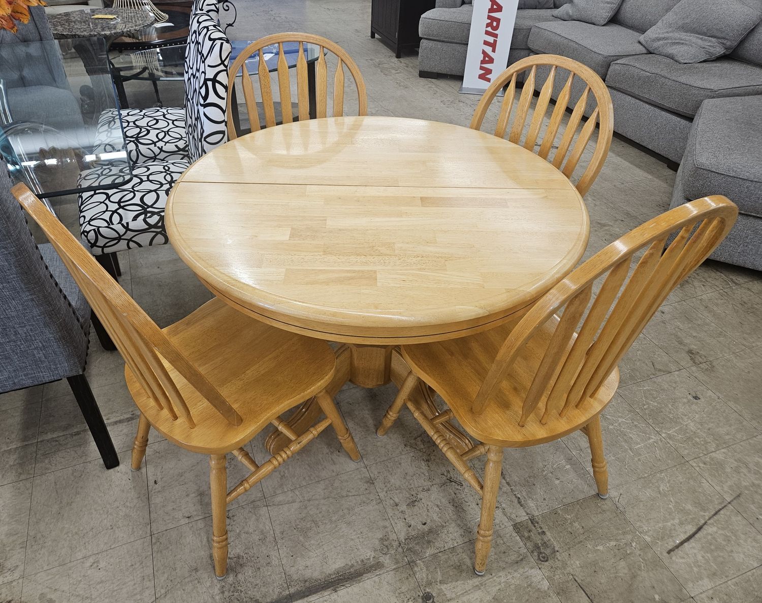 Warm honey round kitchen table &amp; chairs.