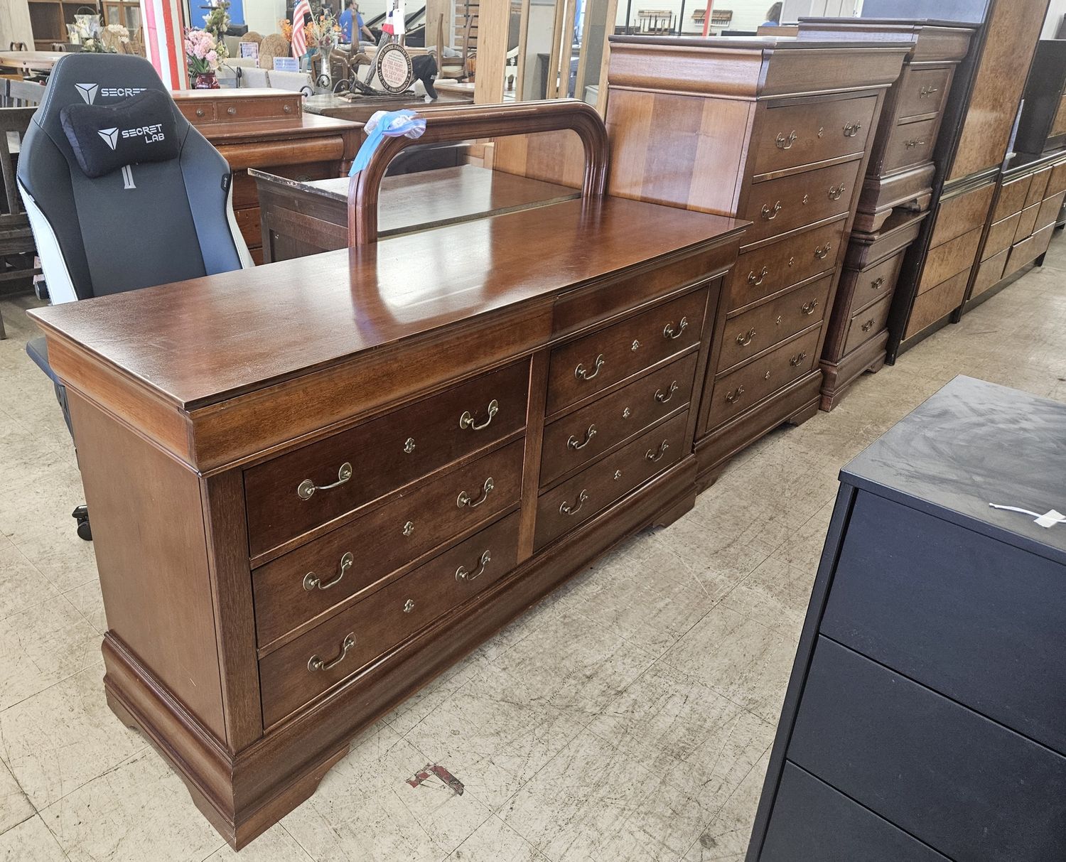 Classic 4-piece bedroom set featuring a dresser with mirror, tall chest, and two matching nightstands