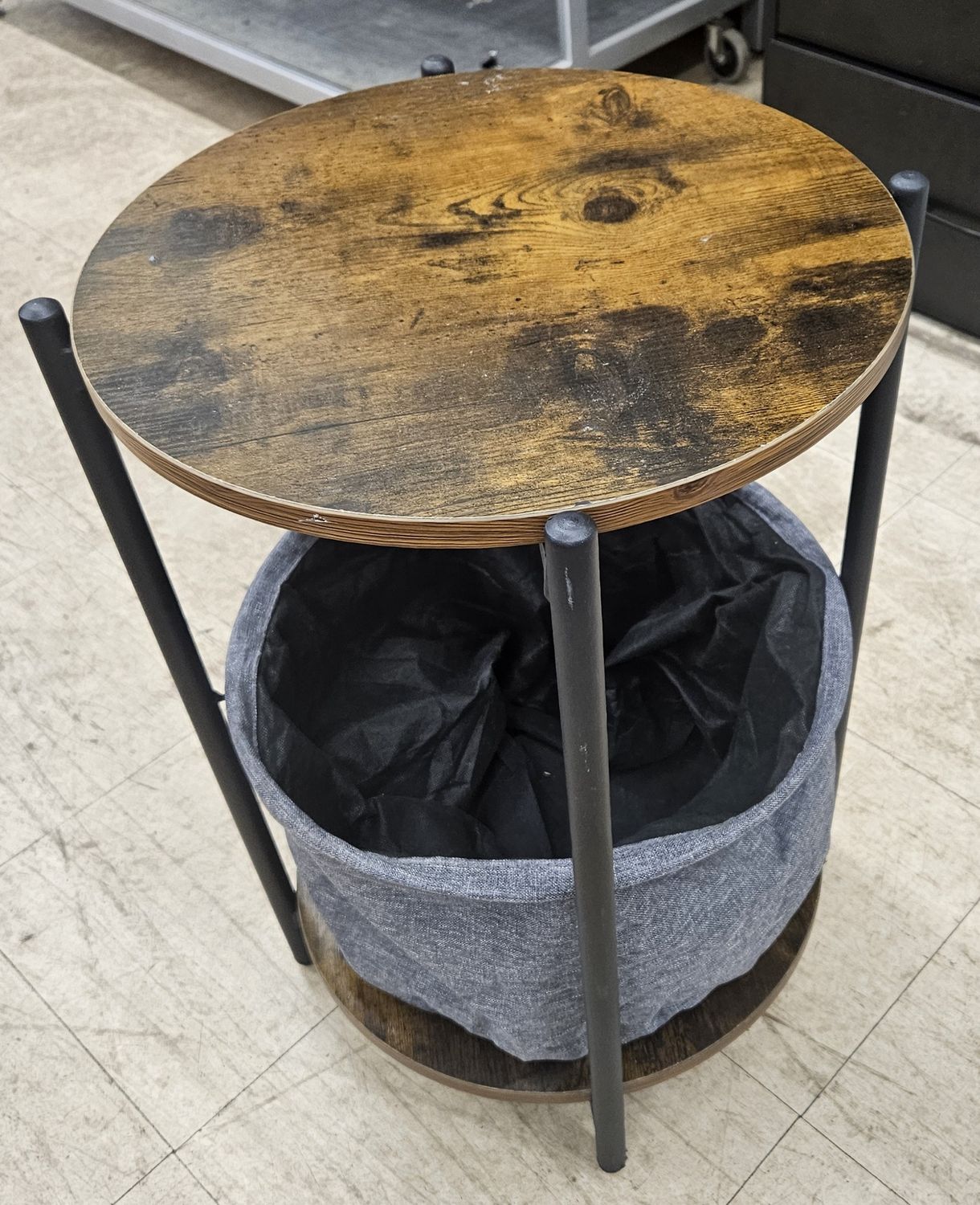 Round side table with a warm wood top