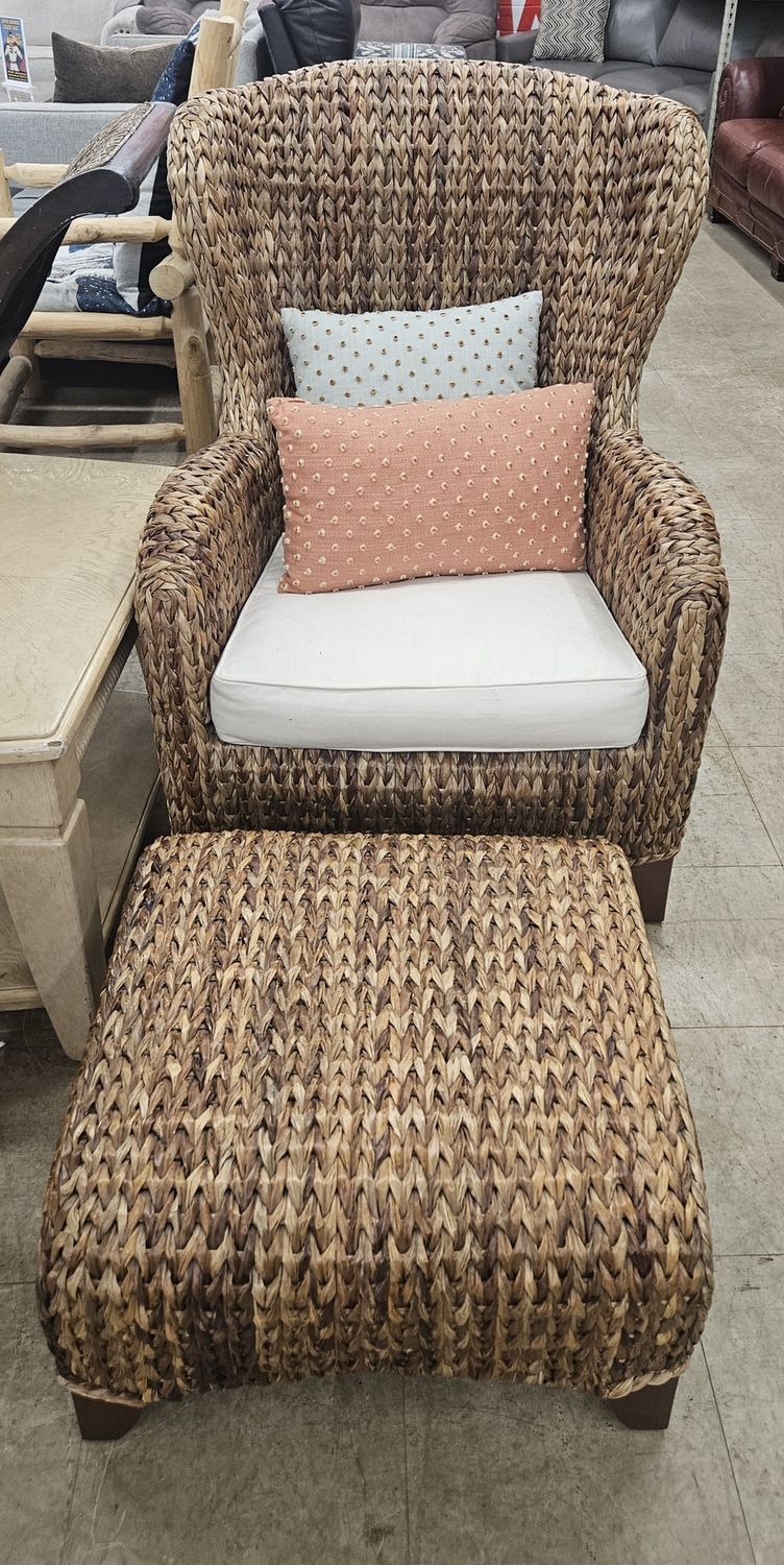 Woven rattan armchair and matching ottoman