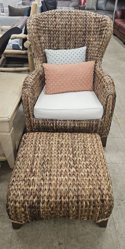 Woven rattan armchair and matching ottoman