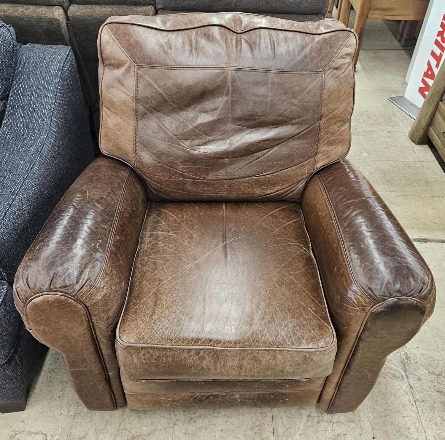 Brown leather reclining armchair