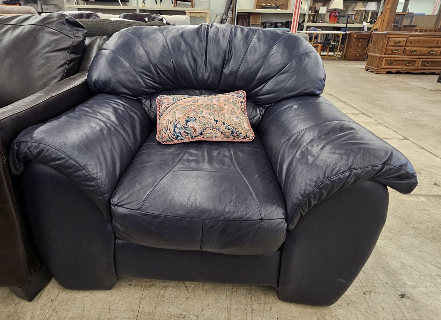 Oversized blue leather armchair