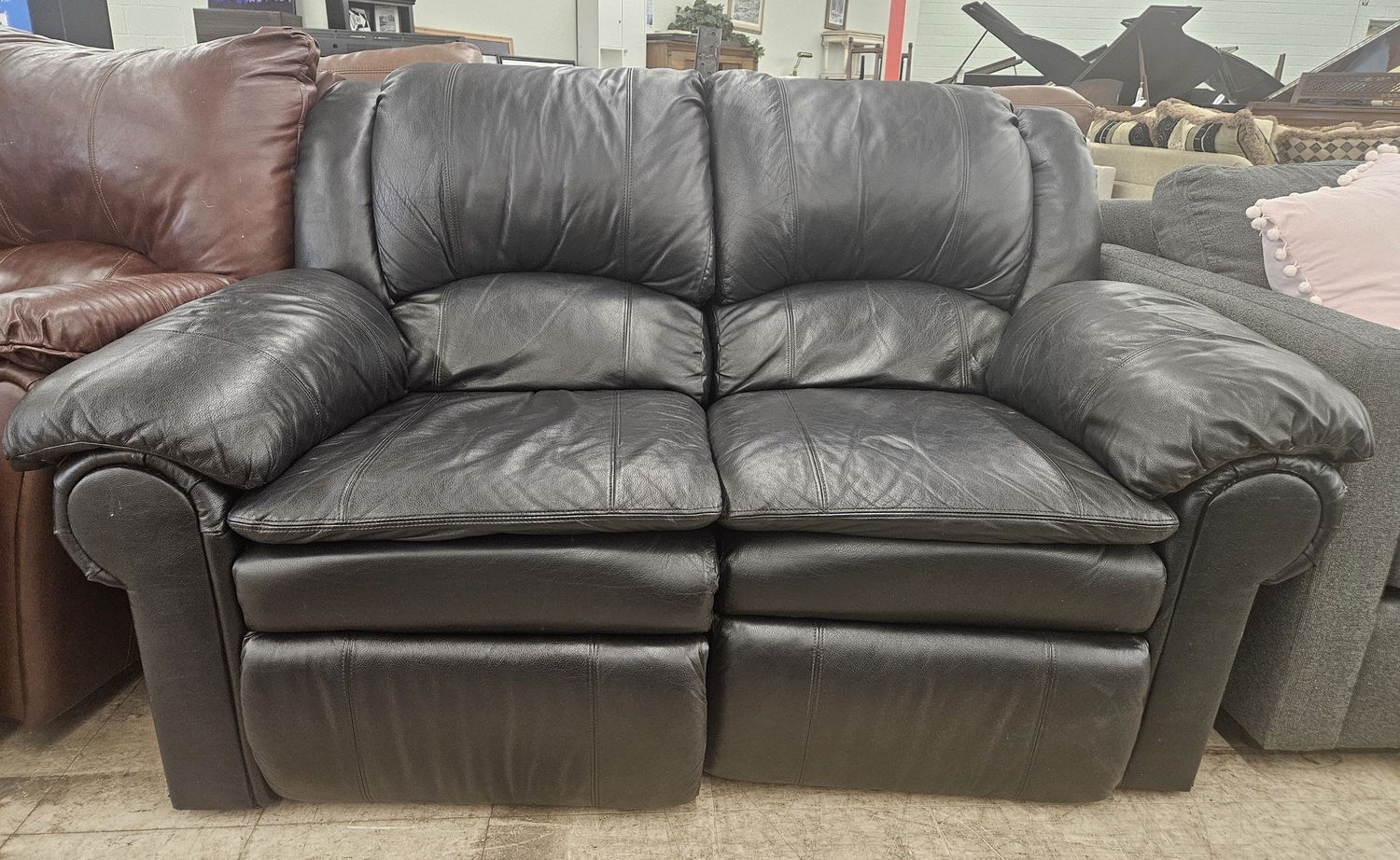 Sleek black leather loveseat recliner!