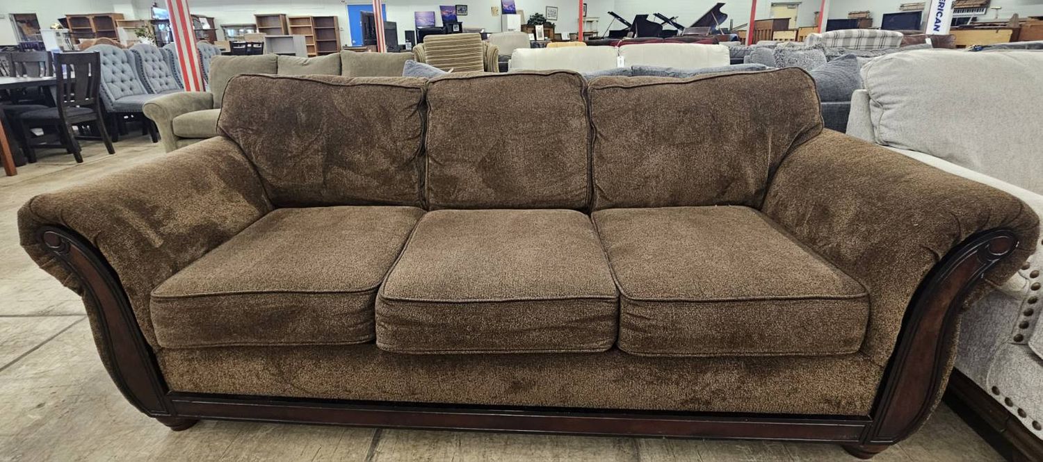 Brown sofa with wood trim