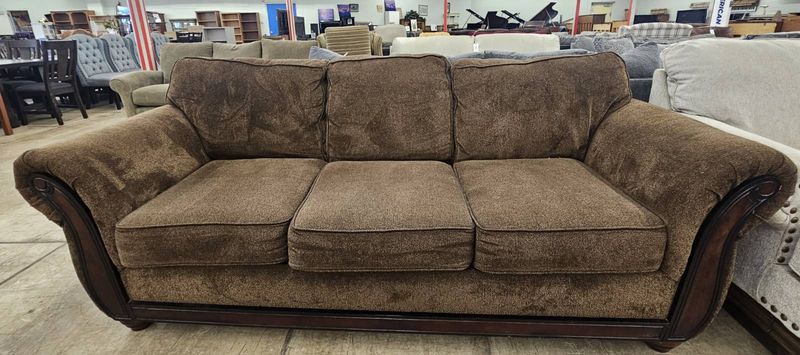 Brown sofa with wood trim