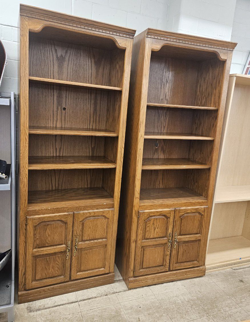 Matching oak bookcases with cabinet doors