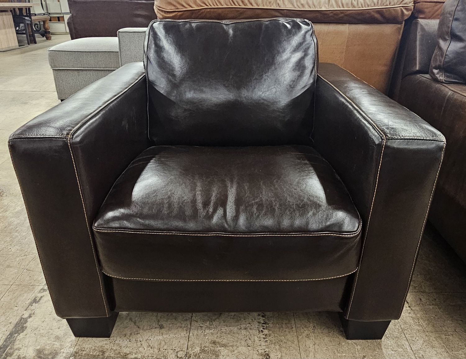 Dark brown leather armchair